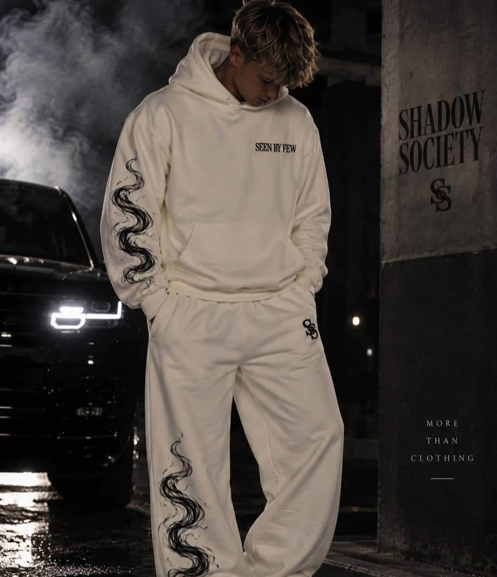 Cream set at night by a black car